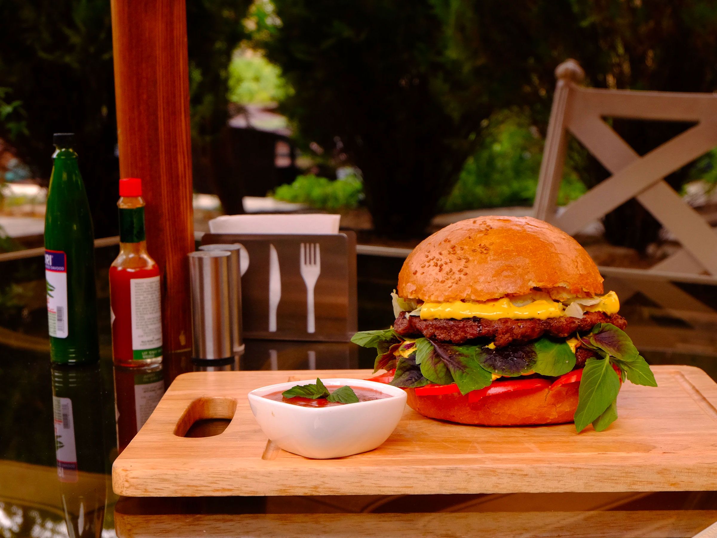 Burger Served On Garden Table Burger Served On Garden Table